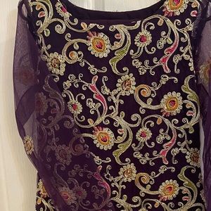 Fully embroidered front and back shirt with straight pants. Never been worn.